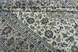 Close-up detail of 2000s Kashan rug from Iran / Persia showing Wool weave