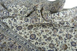 Surface texture of 2000s Kashan rug with natural Wool and intricate pattern