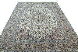 Surface texture of 2000s Kashan rug with natural Wool and intricate pattern