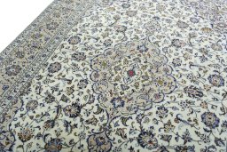 Backside of handmade 2000s Kashan rug showing knot structure and weave density