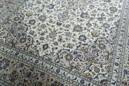 Close-up detail of 2000s Kashan rug from Iran / Persia showing Wool weave