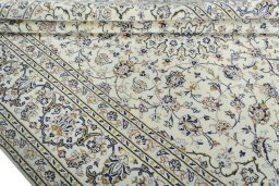 Close-up detail of 2000s Kashan rug from Iran / Persia showing Wool weave