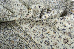Surface texture of 2000s Kashan rug with natural Wool and intricate pattern