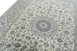 Backside of handmade 2000s Kashan rug showing knot structure and weave density