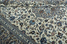 Close-up detail of 2000s Kashan rug from Iran / Persia showing Wool weave