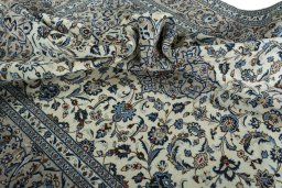 Surface texture of 2000s Kashan rug with natural Wool and intricate pattern