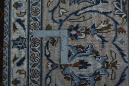 Backside of handmade 2000s Kashan rug showing knot structure and weave density