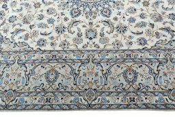 Corner detail of New Kashan rug showing border pattern and Wool pile