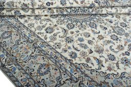 Close-up detail of New Kashan rug from Iran / Persia showing Wool weave