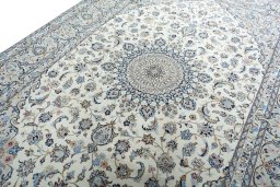Backside of handmade New Kashan rug showing knot structure and weave density