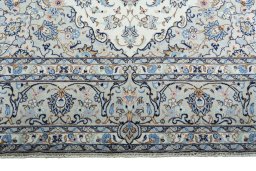 Full view of New Kashan rug from Iran / Persia, 360 × 245 cm in Beige tones