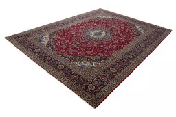 Corner detail of 2000s Kashan rug showing border pattern and Wool pile