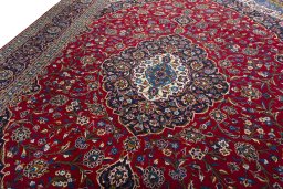 Backside of handmade 2000s Kashan rug showing knot structure and weave density