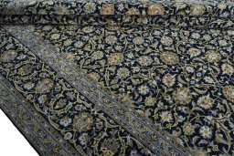 Close-up detail of 2000s Kashan rug from Iran / Persia showing Cork weave