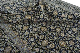 Surface texture of 2000s Kashan rug with natural Cork and intricate pattern