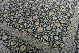 Close-up detail of 2000s Kashan rug from Iran / Persia showing Cork weave