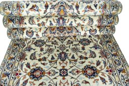 Corner detail of 2000s Kashan rug showing border pattern and Wool pile