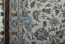 Surface texture of 2000s Kashan rug with natural Wool and intricate pattern