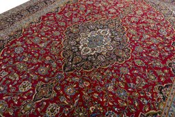 Backside of handmade 2000s Kashan rug showing knot structure and weave density
