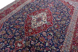 Backside of handmade 2000s Kashan rug showing knot structure and weave density