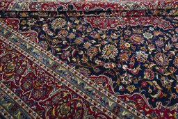 Close-up detail of 2000s Kashan rug from Iran / Persia showing Wool weave