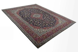 Close-up detail of 2000s Kashan rug from Iran / Persia showing Wool weave