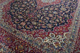 Close-up detail of 2000s Kashan rug from Iran / Persia showing Wool weave