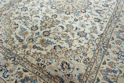 Close-up detail of 2000s Kashan rug from Iran / Persia showing Wool weave