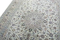 Backside of handmade 2000s Kashan rug showing knot structure and weave density