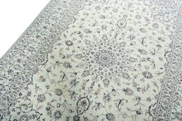 Backside of handmade New Kashan rug showing knot structure and weave density