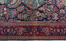 Corner detail of 1930s Kashan rug showing border pattern and Wool pile