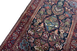 Backside of handmade 1930s Kashan rug showing knot structure and weave density