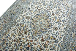 Backside of handmade 2000s Kashan rug showing knot structure and weave density