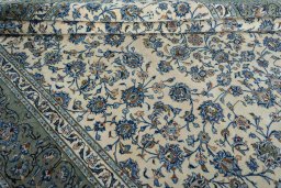 Close-up detail of 2000s Kashan rug from Iran / Persia showing Wool weave
