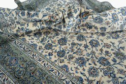 Surface texture of 2000s Kashan rug with natural Wool and intricate pattern