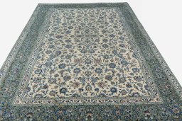 Surface texture of 2000s Kashan rug with natural Wool and intricate pattern