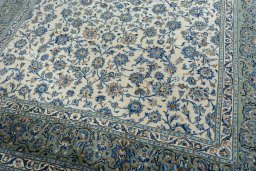 Close-up detail of 2000s Kashan rug from Iran / Persia showing Wool weave