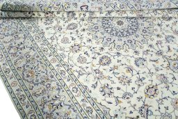 Close-up detail of 2000s Kashan rug from Iran / Persia showing Wool weave