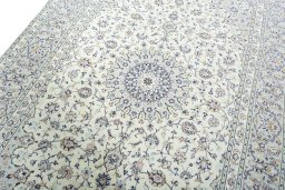 Backside of handmade 2000s Kashan rug showing knot structure and weave density
