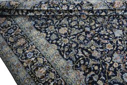 Close-up detail of 2000s Kashan rug from Iran / Persia showing Wool weave