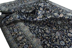 Surface texture of 2000s Kashan rug with natural Wool and intricate pattern