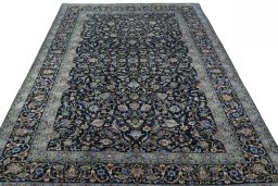 Surface texture of 2000s Kashan rug with natural Wool and intricate pattern