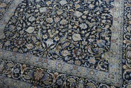 Close-up detail of 2000s Kashan rug from Iran / Persia showing Wool weave