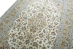 Backside of handmade 2000s Kashan rug showing knot structure and weave density