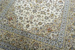 Close-up detail of 2000s Kashan rug from Iran / Persia showing Wool weave