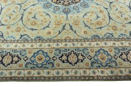 Corner detail of 2000s Kashan rug showing border pattern and Wool pile