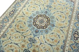 Backside of handmade 2000s Kashan rug showing knot structure and weave density