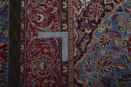 Surface texture of 2000s Kashan rug with natural Wool and intricate pattern