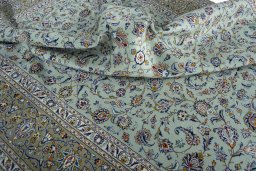 Close-up detail of 2000s Kashan rug from Iran / Persia showing Wool weave