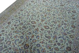 Backside of handmade 2000s Kashan rug showing knot structure and weave density